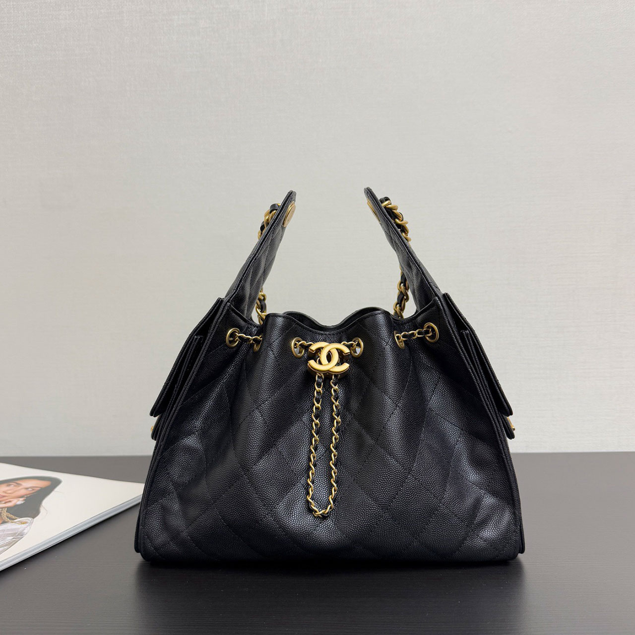 CHANEL black caviar diamond grid gold tag drawstring tote bucket bag