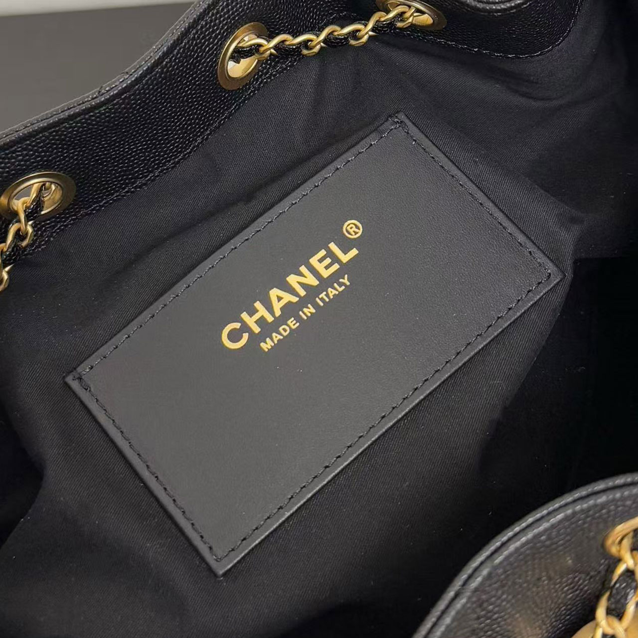 CHANEL black caviar diamond grid gold tag drawstring tote bucket bag