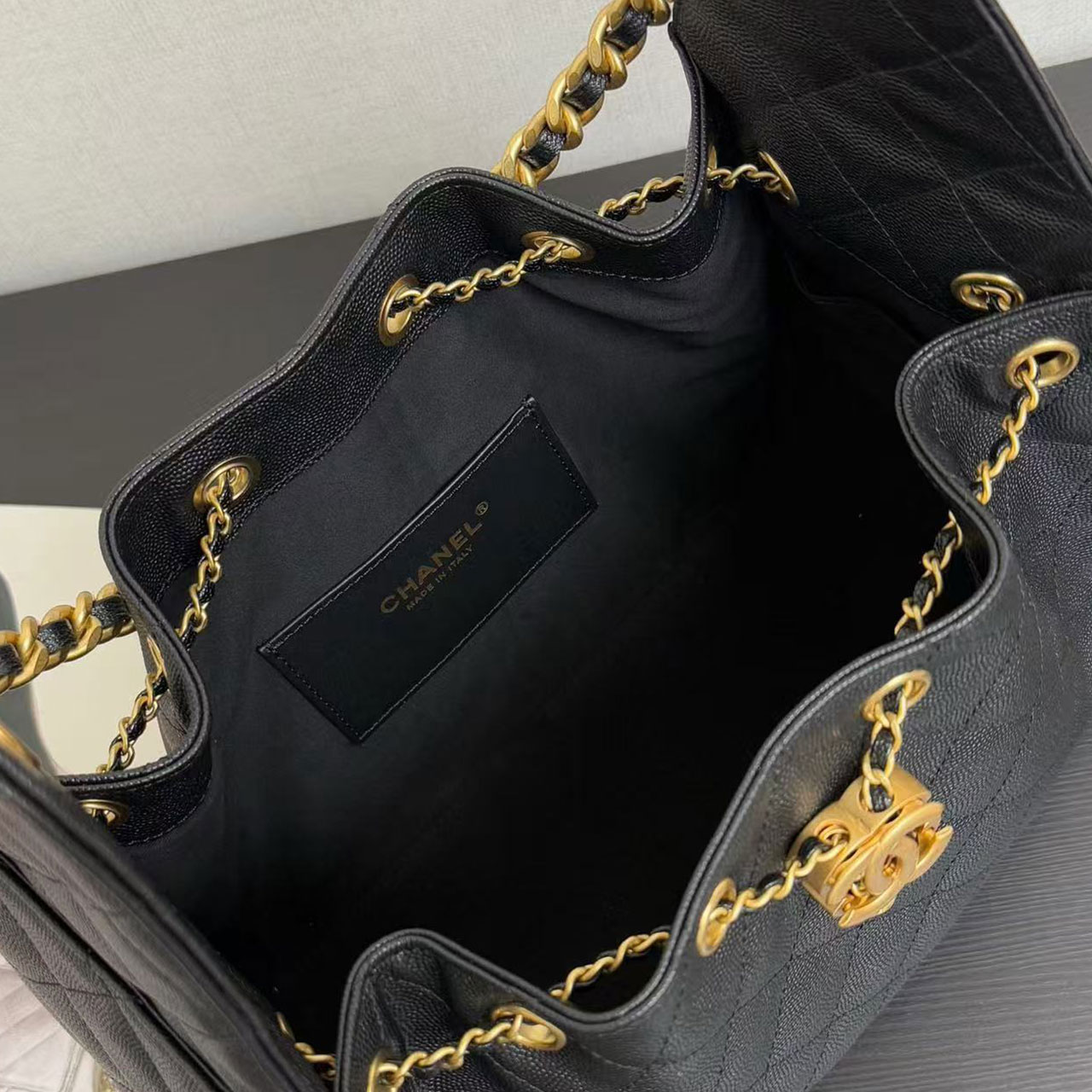 CHANEL black caviar diamond grid gold tag drawstring tote bucket bag