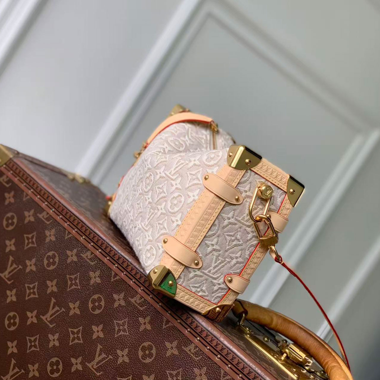 LV light white relief old flower woven hand-held hard box crossbody bag