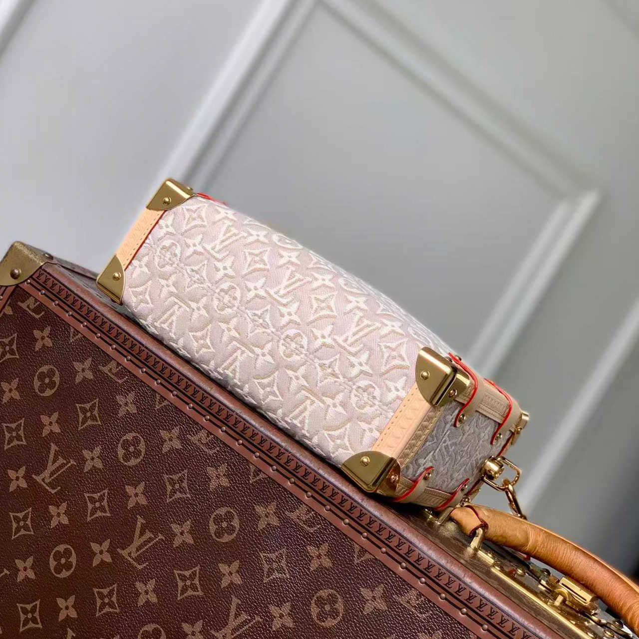 LV light white relief old flower woven hand-held hard box crossbody bag