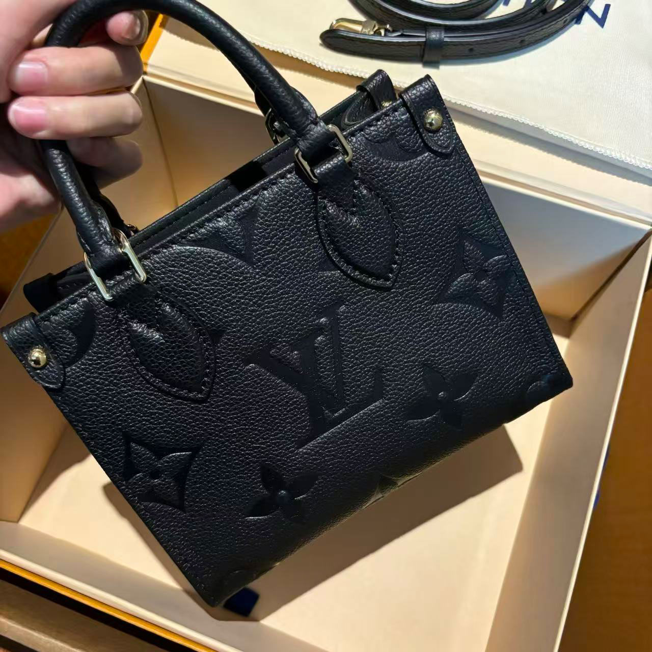 LV black embossed cowhide mini Onthego tote bag