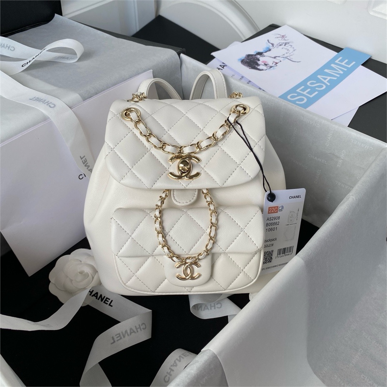 CHANEL beige lambskin diamond grid mini backpack
