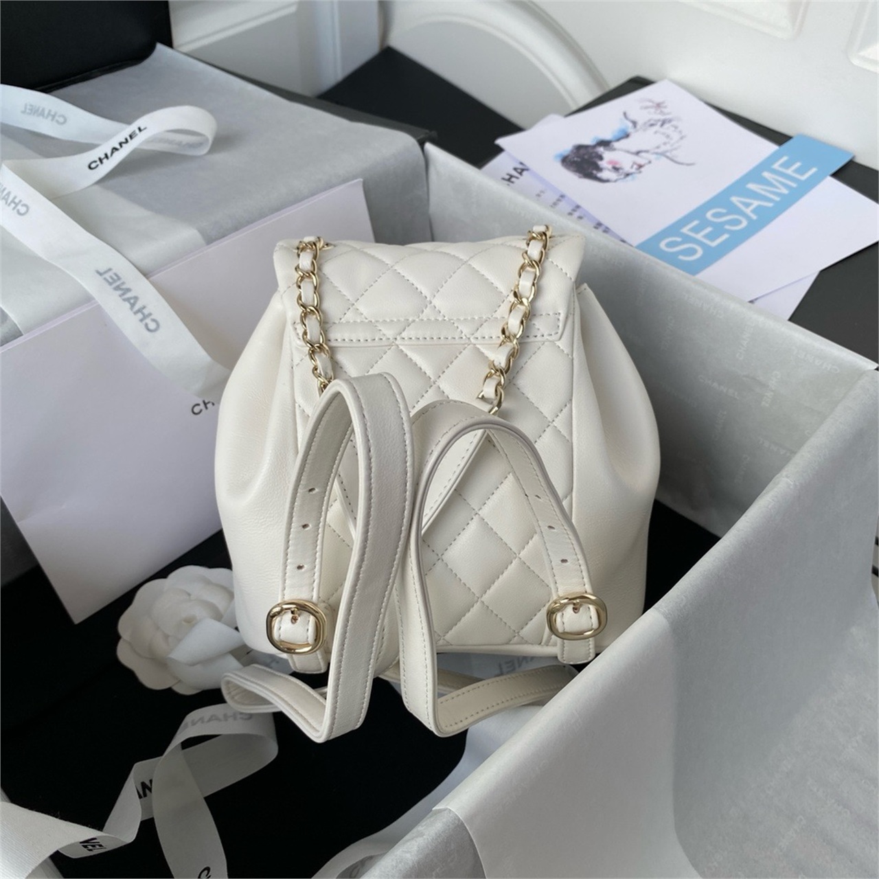 CHANEL beige lambskin diamond grid mini backpack