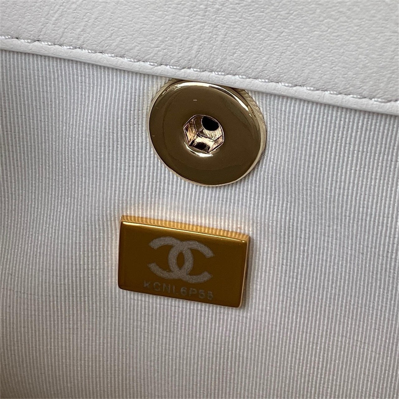 CHANEL beige lambskin diamond grid mini backpack