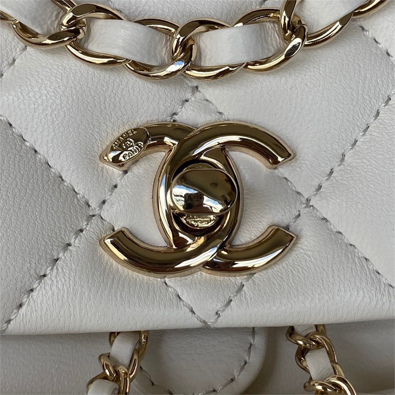 CHANEL beige lambskin diamond grid mini backpack