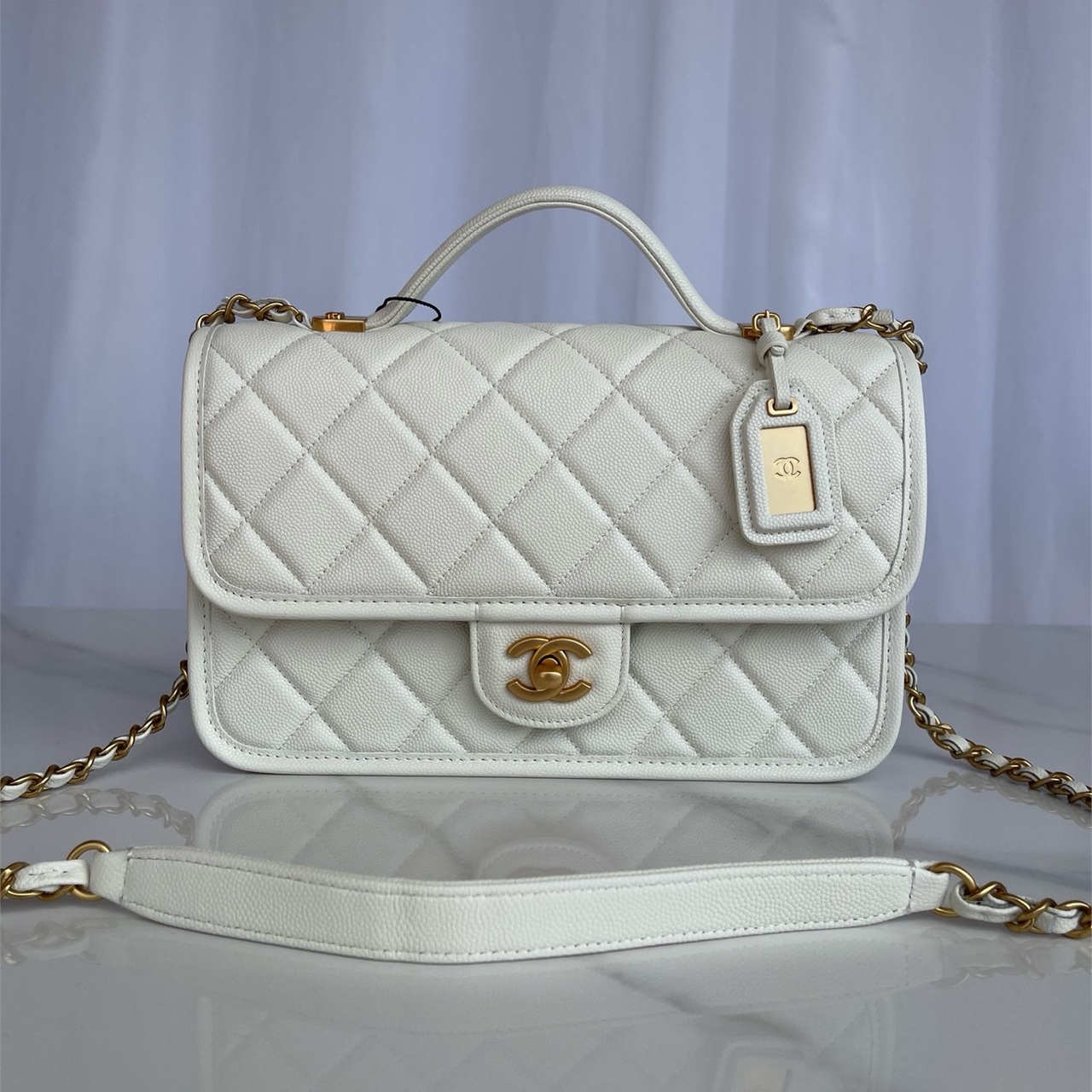 CHANEL beige caviar cowhide hand-held CF tag chain bag