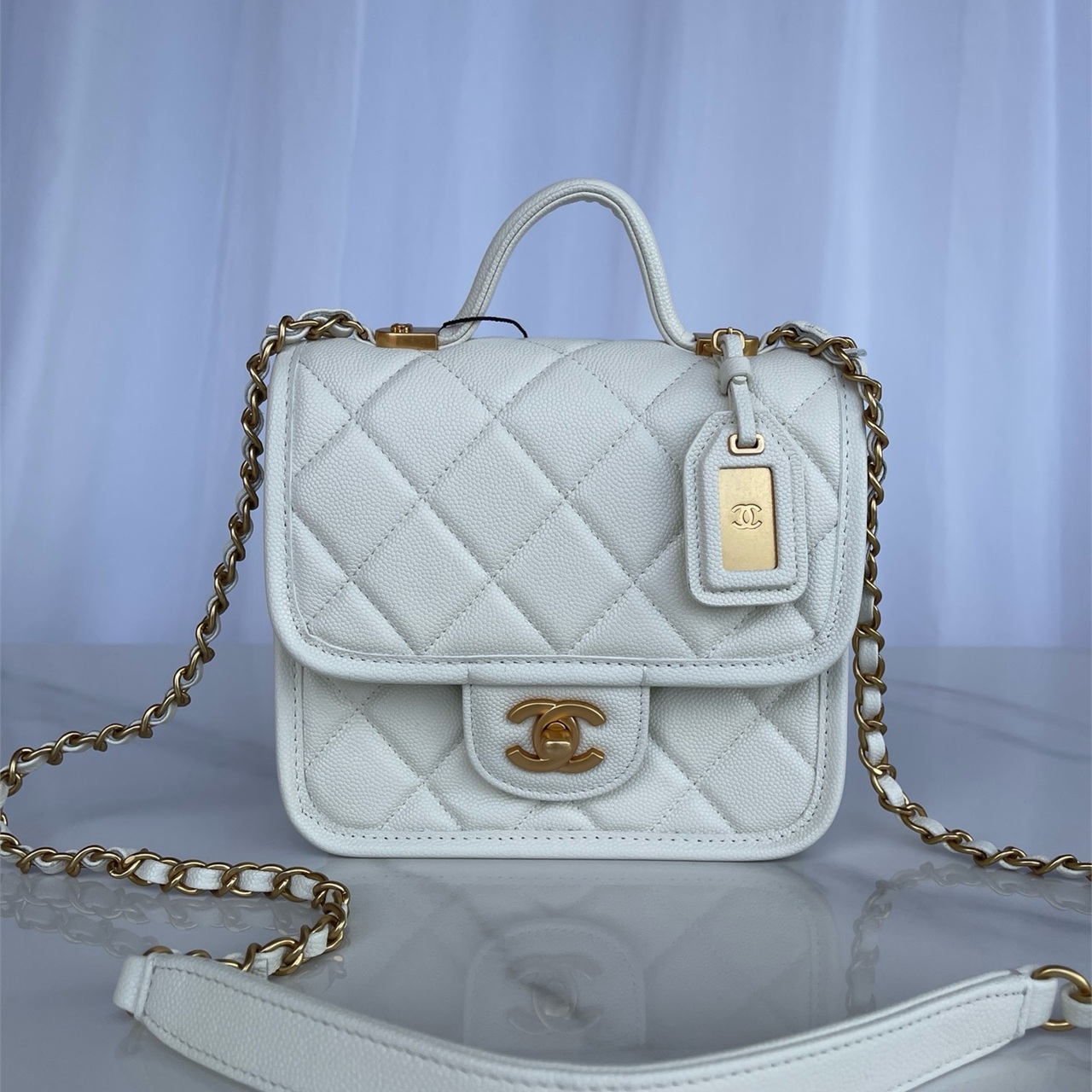 CHANEL beige caviar cowhide hand-held CF tag chain bag