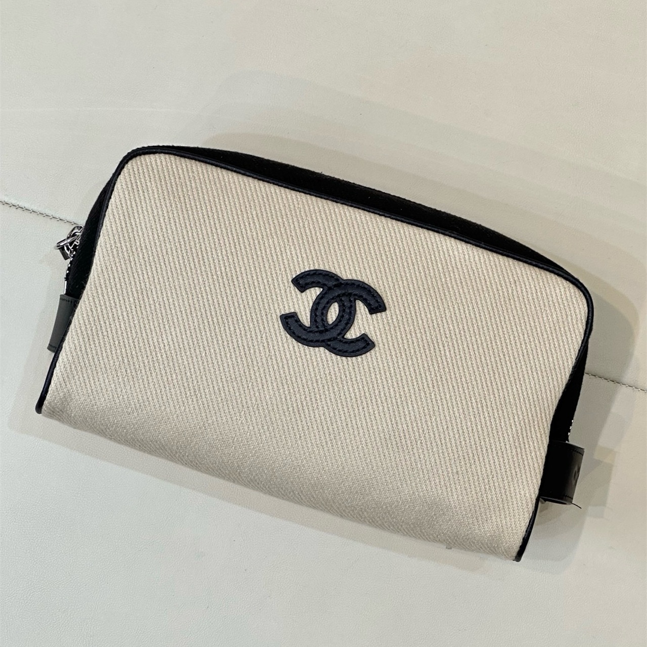 CHANEL white canvas with black leather zipper makeup storage handbag