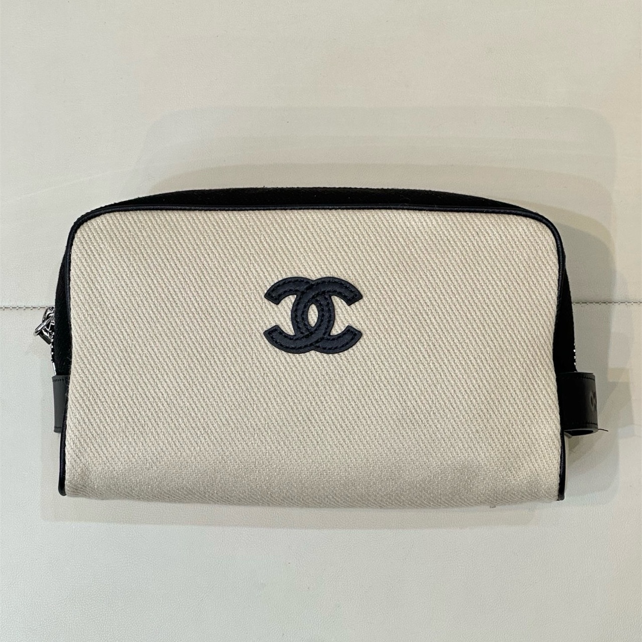 CHANEL white canvas with black leather zipper makeup storage handbag